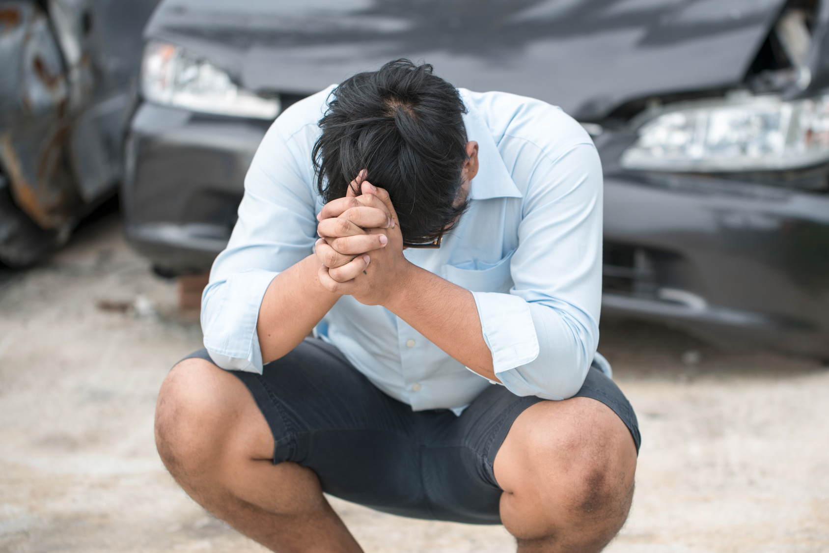 praying guy by crashed car-immediate.jpg